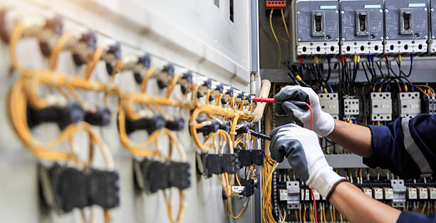 Professional Electrician technician working in Loma, CO